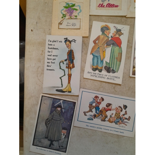 119 - World War I era silk cards & comedy cards and a tin of cigarette cards, mainly Players, packeted by ... 