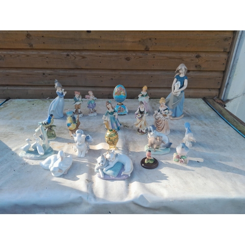 135 - Decorative china ornaments, Nao included note one with restoration