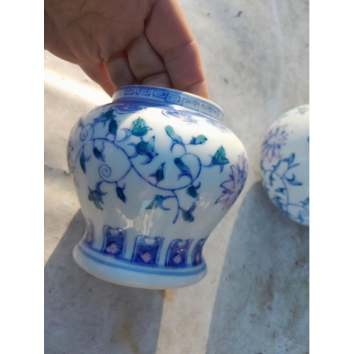 148 - Pair of 20th century Chinese blue and white vases with character marks underneath in good order