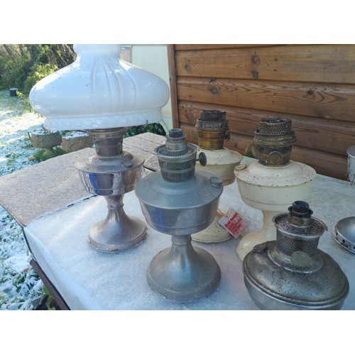 11 - Collection of paraffin lamps some spares etc.