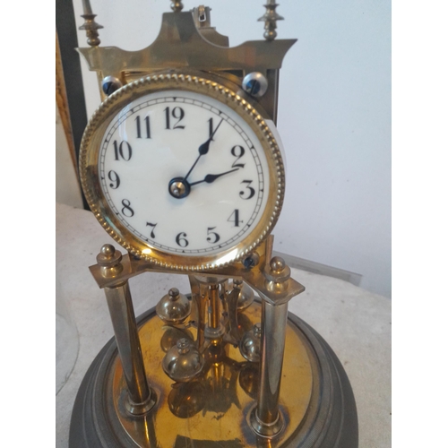 38 - Early 20th century Anniversary clock in glass dome (chipped but still intact), with key