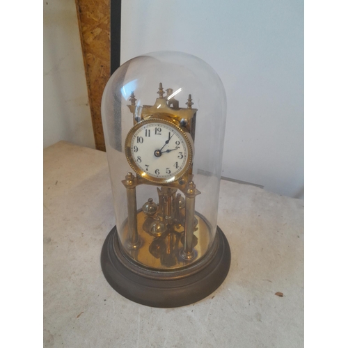 38 - Early 20th century Anniversary clock in glass dome (chipped but still intact), with key