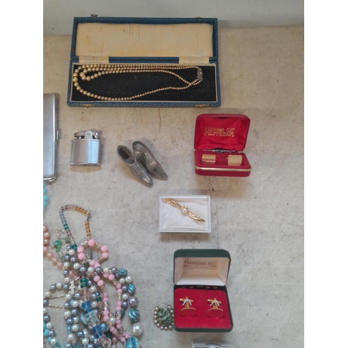 100 - Costume jewellery, some in boxes . simulated pearls, cufflinks etc.