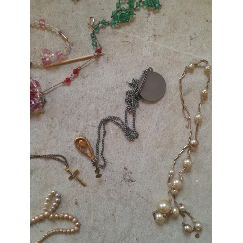 103 - Assorted costume jewellery : gold plated mourning brooch, necklaces, buckles, simulated pearls etc.