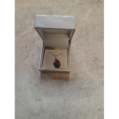 108 - 15 ct pendant set with cherry amber on a necklace 4 g gross weight in a box of issue