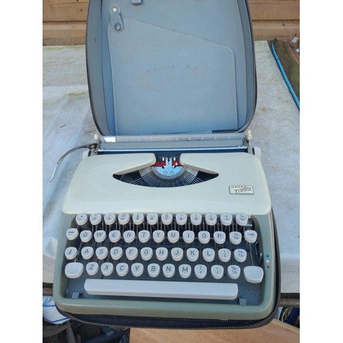 195 - Vintage typewriter and 78 records, mixed themed,