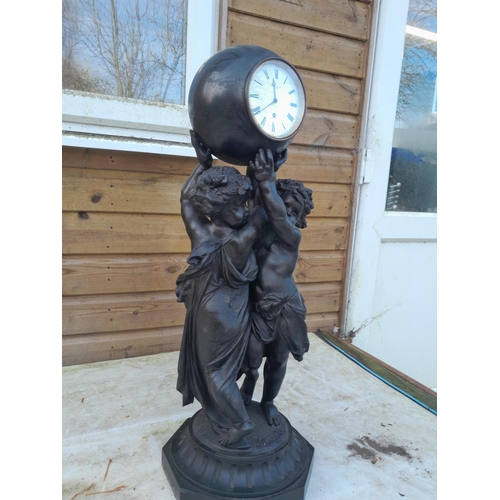 222 - An impressive 19th century clock by James McCabe of London No 3363 in a painted spelter Cherub case ... 