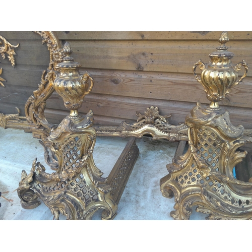 223 - An Elegant late 19th century French gilded metal fireside set including : Spark guard, kerb and tool... 