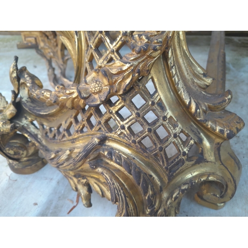 223 - An Elegant late 19th century French gilded metal fireside set including : Spark guard, kerb and tool... 