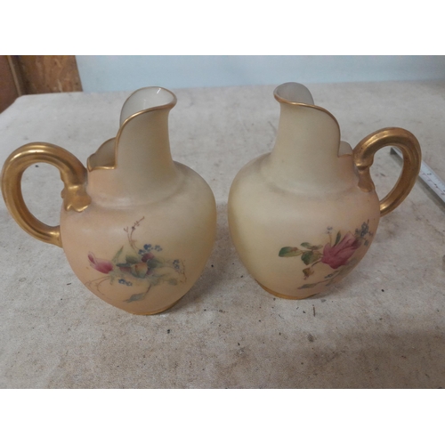 286 - Pair of Royal Worcester blush ivory porcelain small size jugs with floral decoration in good order