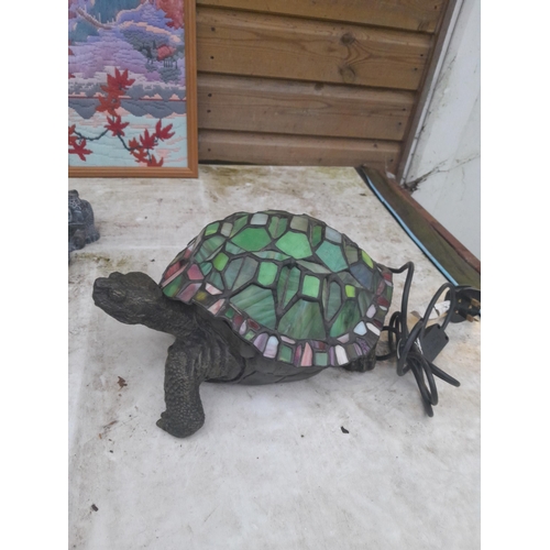 298 - Resin and glass tortoise lamp, slate ornament tapestry etc.