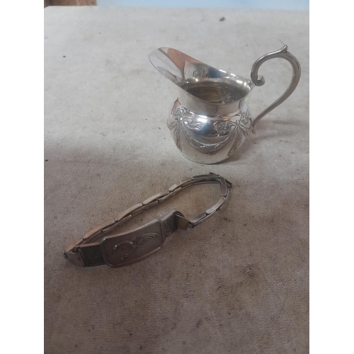 449 - 900 silver jug and Chinese articulated silver bracelet