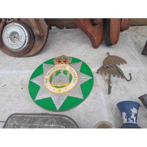 580 - Treen and wooden ware : apprentice piece oak bench, Devonshire Regiment wall plaque, barometer etc.