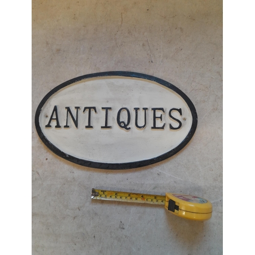 727 - Cast iron Antiques sign