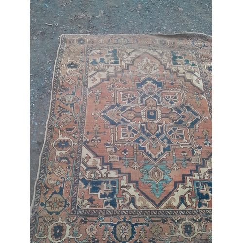 771 - Early 20th century hand woven Persian wool rug, condition needs a clean but overall not bad 67 