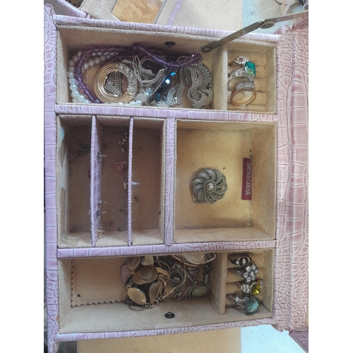 784 - Costume jewellery in a case , small amount of silver noticed, dress rings etc.