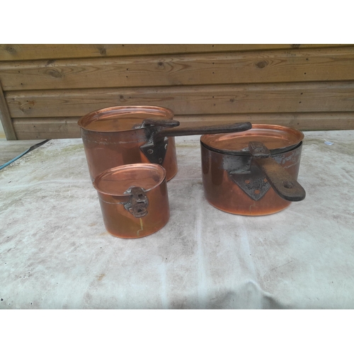 145A - Set of three graduated Georgian copper saucepans with matching lids