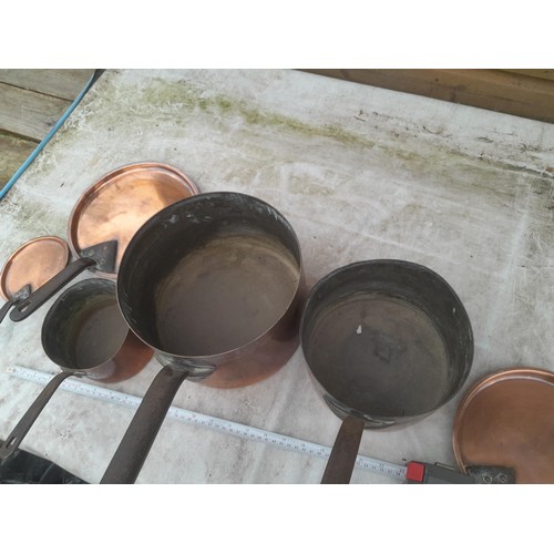 145A - Set of three graduated Georgian copper saucepans with matching lids