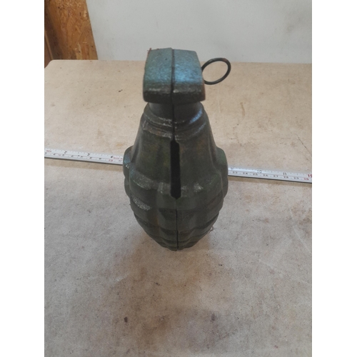 576 - Cast iron money box shaped as a grenade