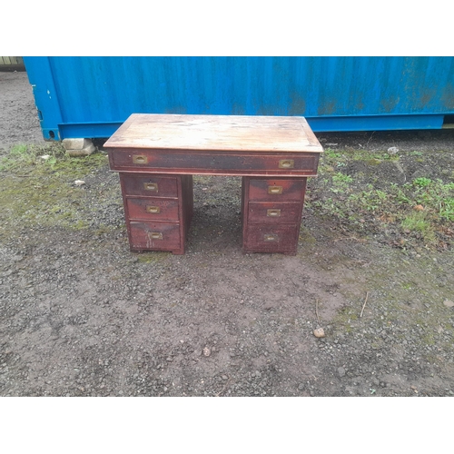 867 - Early 20th century campaign style kneehole desk with recessed brass handles, splits into 3 pieces fo... 