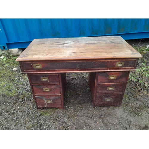 867 - Early 20th century campaign style kneehole desk with recessed brass handles, splits into 3 pieces fo... 