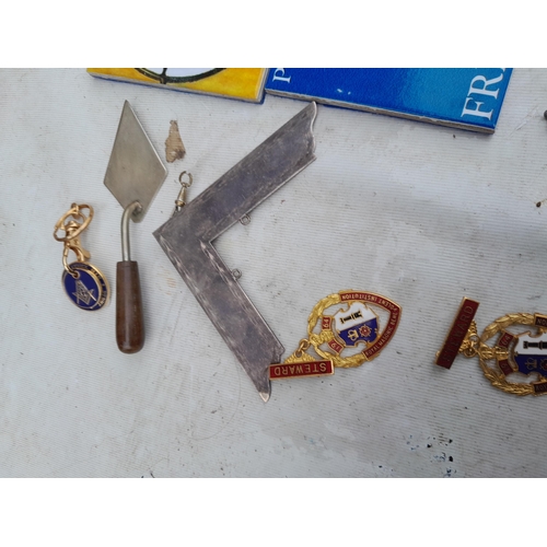 201 - Masonic related items : plated trowel, past Master jewel and other badges etc.