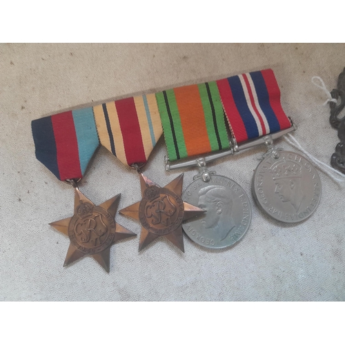 428 - Militaria : cap and arm badges, World War II medal set , buttons and pips, and related items