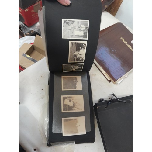 3 - 2 x vintage black and white photograph albums of family snaps, one sparsely filled the other almost ... 