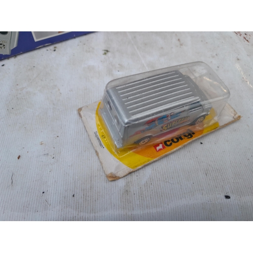 42 - Box of oddments : untested lap top computer, boxed Corgi die cast toy car, plated lighter modelled a... 