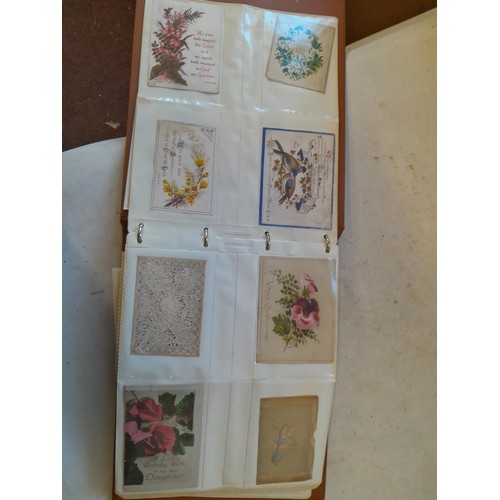 107 - Array of approx 200 greeting cards from early - mid 20th century in an album with two further empty ... 