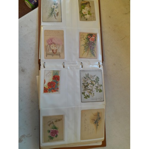 107 - Array of approx 200 greeting cards from early - mid 20th century in an album with two further empty ... 