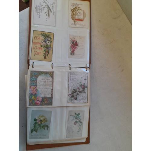 107 - Array of approx 200 greeting cards from early - mid 20th century in an album with two further empty ... 