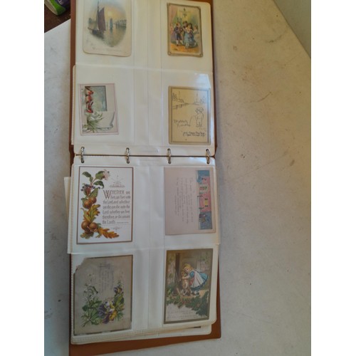 107 - Array of approx 200 greeting cards from early - mid 20th century in an album with two further empty ... 