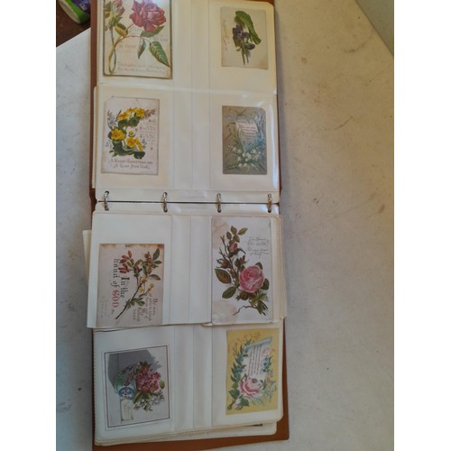 107 - Array of approx 200 greeting cards from early - mid 20th century in an album with two further empty ... 