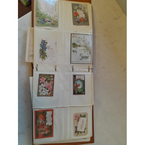 107 - Array of approx 200 greeting cards from early - mid 20th century in an album with two further empty ... 