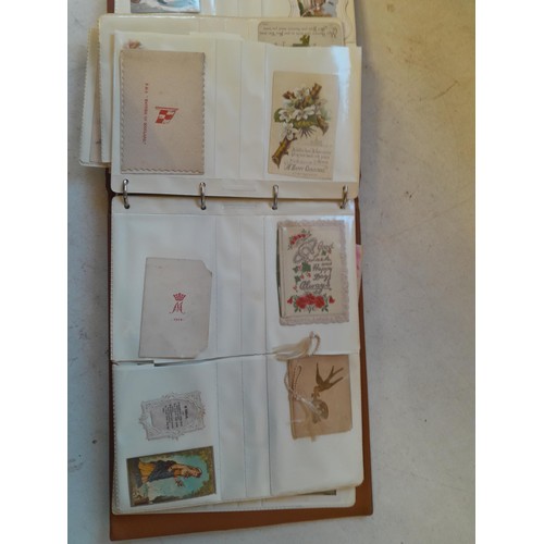 107 - Array of approx 200 greeting cards from early - mid 20th century in an album with two further empty ... 