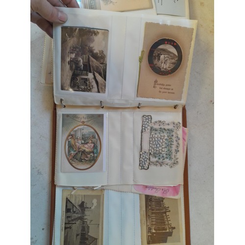 107 - Array of approx 200 greeting cards from early - mid 20th century in an album with two further empty ... 