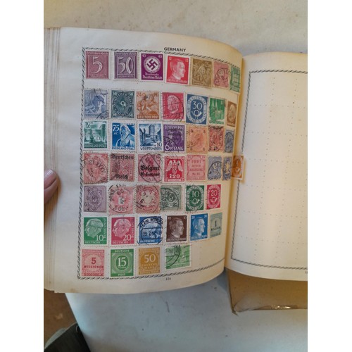 114 - Stamps : a varied collection of mainly used stamps of the world in a variety of albums, schoolboy co... 