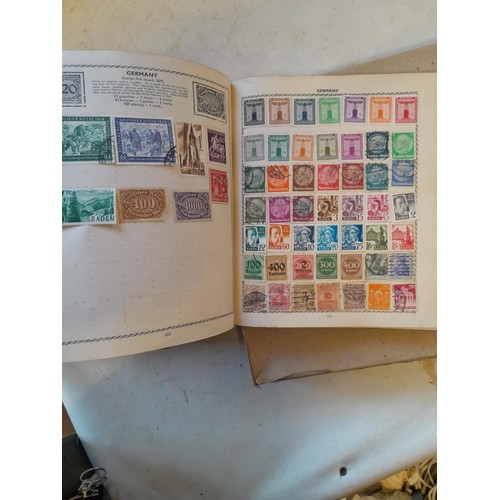 114 - Stamps : a varied collection of mainly used stamps of the world in a variety of albums, schoolboy co... 