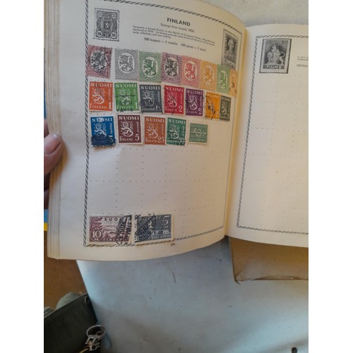 114 - Stamps : a varied collection of mainly used stamps of the world in a variety of albums, schoolboy co... 