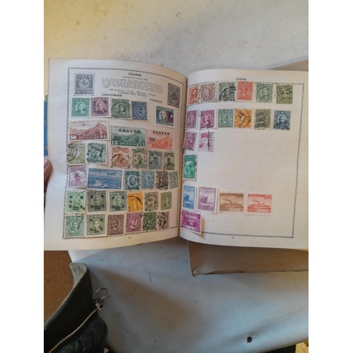 114 - Stamps : a varied collection of mainly used stamps of the world in a variety of albums, schoolboy co... 