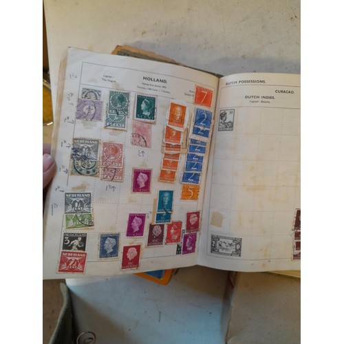 114 - Stamps : a varied collection of mainly used stamps of the world in a variety of albums, schoolboy co... 