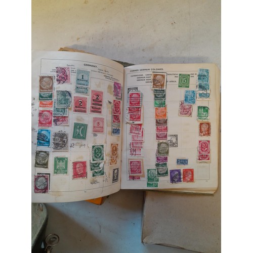 114 - Stamps : a varied collection of mainly used stamps of the world in a variety of albums, schoolboy co... 