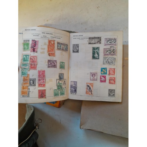 114 - Stamps : a varied collection of mainly used stamps of the world in a variety of albums, schoolboy co... 