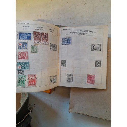 114 - Stamps : a varied collection of mainly used stamps of the world in a variety of albums, schoolboy co... 