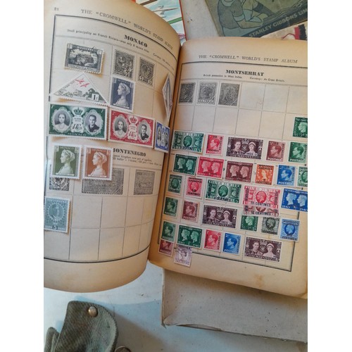 114 - Stamps : a varied collection of mainly used stamps of the world in a variety of albums, schoolboy co... 