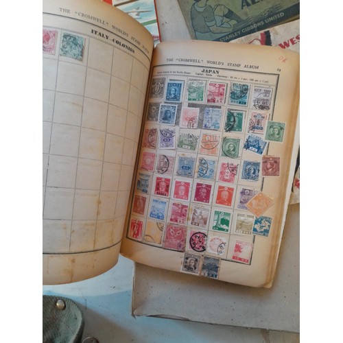 114 - Stamps : a varied collection of mainly used stamps of the world in a variety of albums, schoolboy co... 