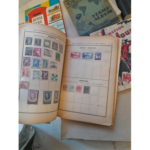 114 - Stamps : a varied collection of mainly used stamps of the world in a variety of albums, schoolboy co... 