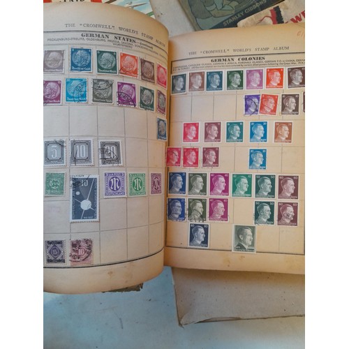 114 - Stamps : a varied collection of mainly used stamps of the world in a variety of albums, schoolboy co... 