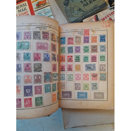 114 - Stamps : a varied collection of mainly used stamps of the world in a variety of albums, schoolboy co... 